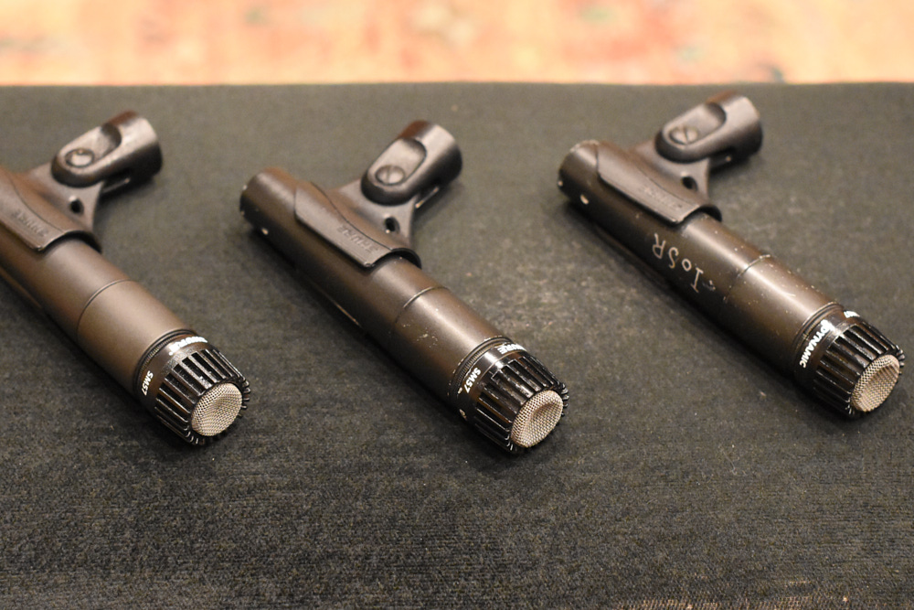 Three Shure SM57 dynamic microphones